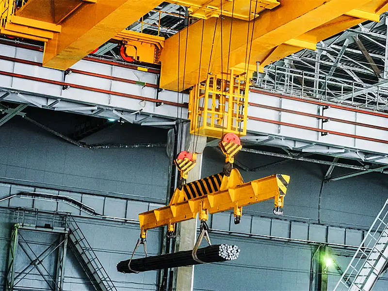 Double-girder crane with electromagnetic lifting device